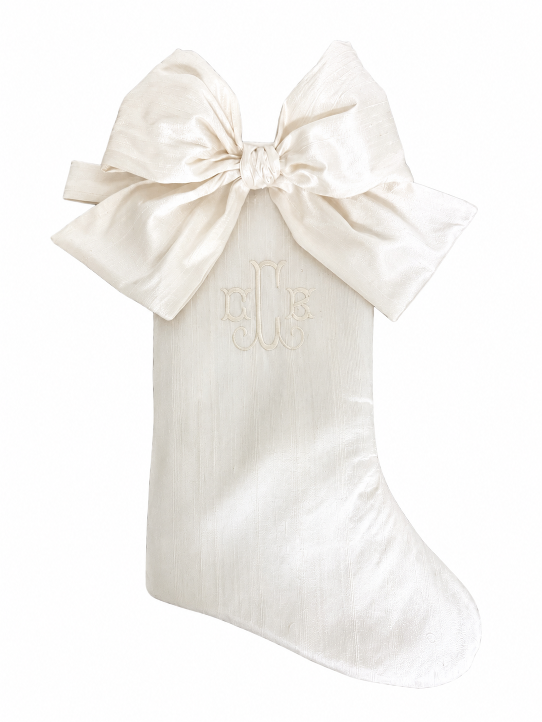 Personalized ivory silk dupioni Christmas stocking with matching ivory bow and monogram
